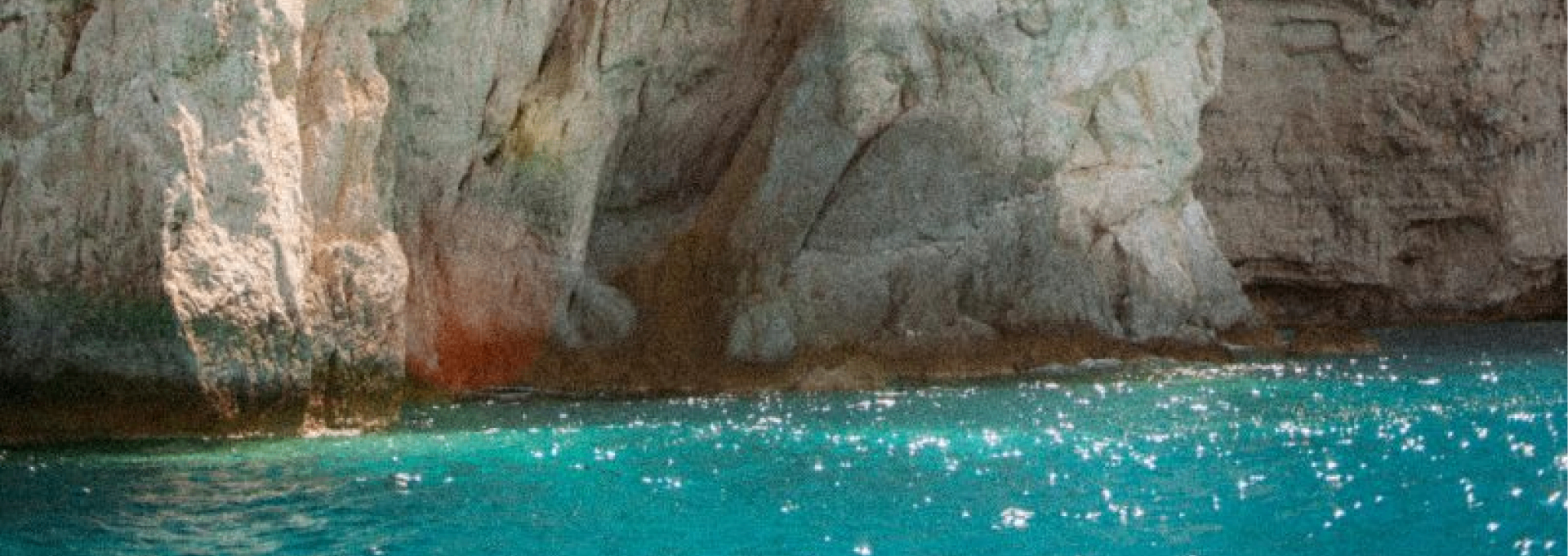 Turquoise cove and green coastline in Corfu, Greece